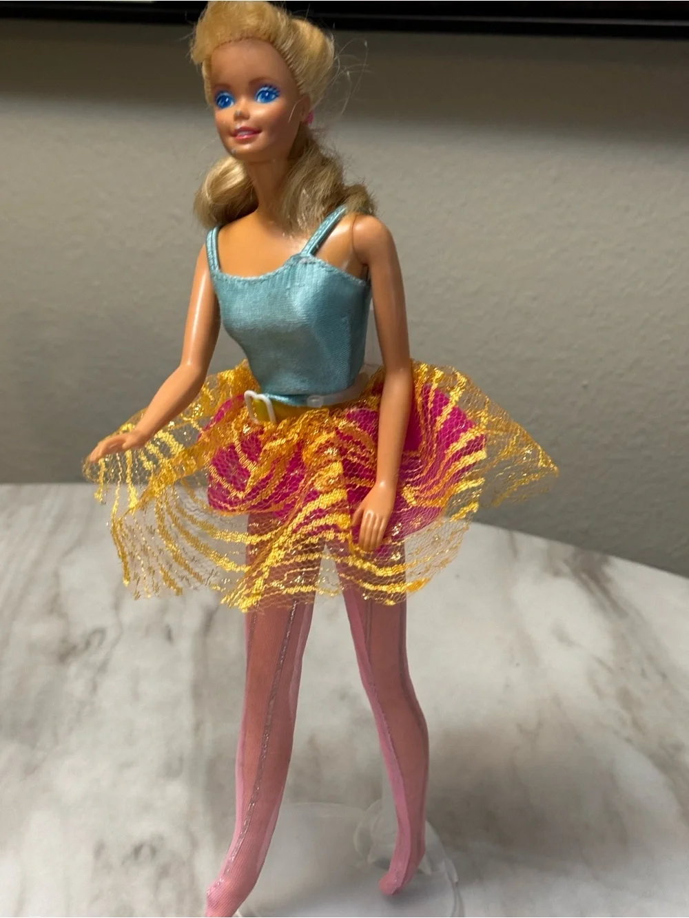 vintage blonde 1998 Bubble Fairy Barbie doll wearing a light blue top and a pink